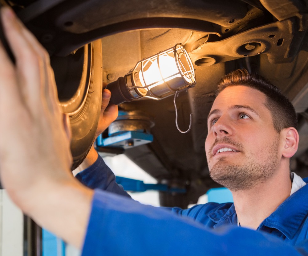 Mechanic checking a vehicle - MOT Testing Oxford